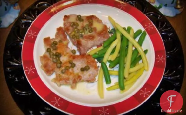 Schweinefleisch-Jakobsmuschel mit Butter-Kapern-Sauce