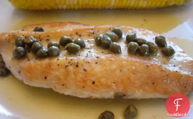 Putenkoteletts mit Zitrussauce und Kapern
