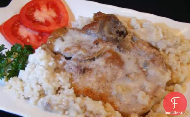 Gebackene Schweinekoteletts mit Reis