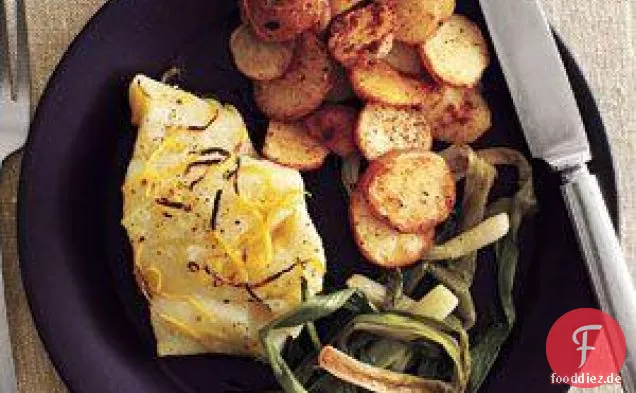 Gebratener Kabeljau und Jakobsmuscheln mit gewürzten Kartoffeln