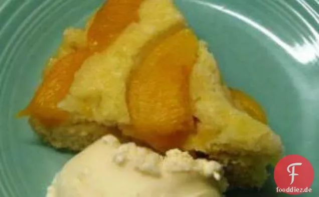 Fettarmer Pfirsich auf dem Kopf Kuchen