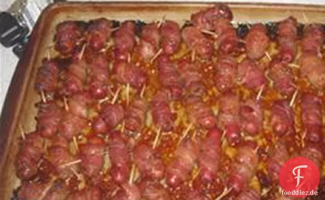 Mit Speck umwickelte Hotdogs