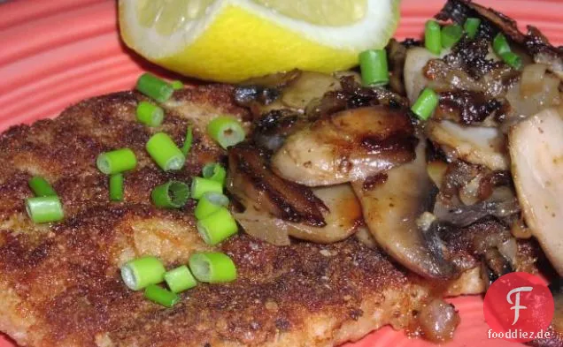 Panierte Schweineschnitzel mit Pilzsauce