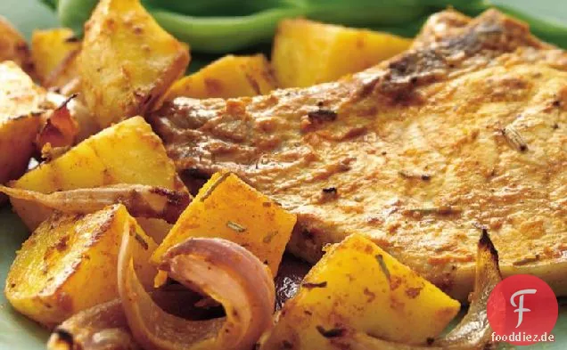 Gebratene Rosmarin Schweinekoteletts und Kartoffeln