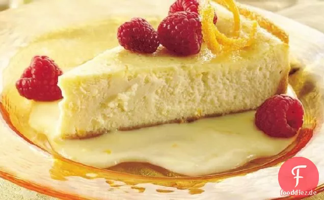 Üppiger Orangenkäsekuchen mit Himbeeren