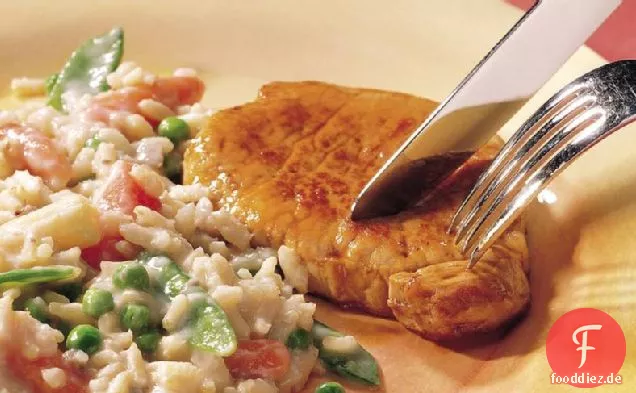 Schweinekotelett Abendessen mit Reis und Gemüse