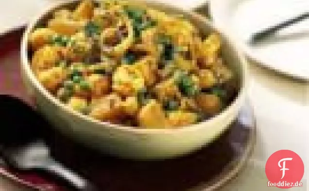 Currykartoffeln, Blumenkohl und Erbsen