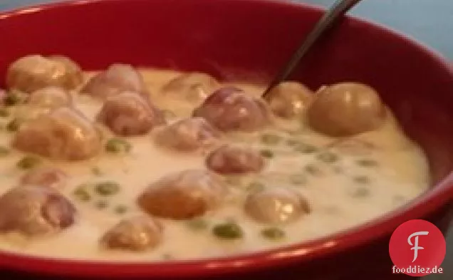 Cremige Erbsen und neue Kartoffeln