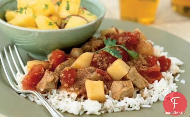 Indisch gewürztes Schweinefleisch in Tomatensauce