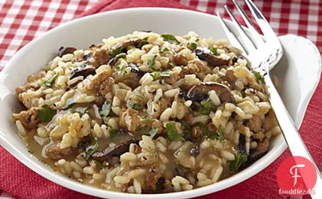 Gebackene Wurst und Pilzrisotto