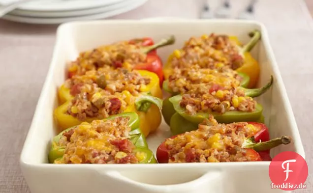 Dreifarbige vegetarische gefüllte Paprika