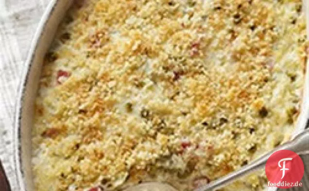 Überbackene Kartoffeln mit Erbsen und Schinken