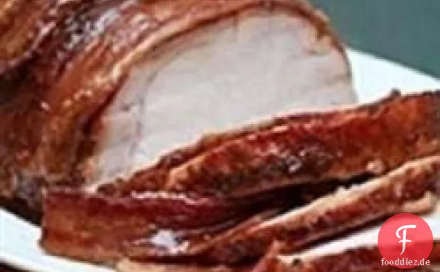 Speck umwickelte Schweinelende mit würziger süßer Glasur