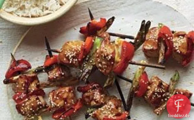 Glasierte Schweinefleisch Kebabs Und Sesam-Reis