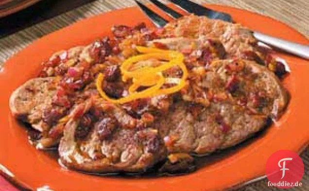Kranzorange Schweinemedaillons