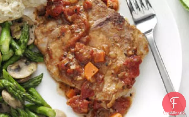 Italienische Schweinekoteletts mit Tomatenspitze