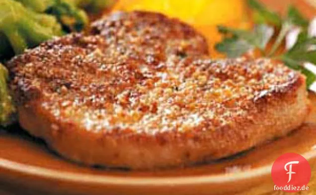 Knusprige kräuterbeschichtete Schweinekoteletts