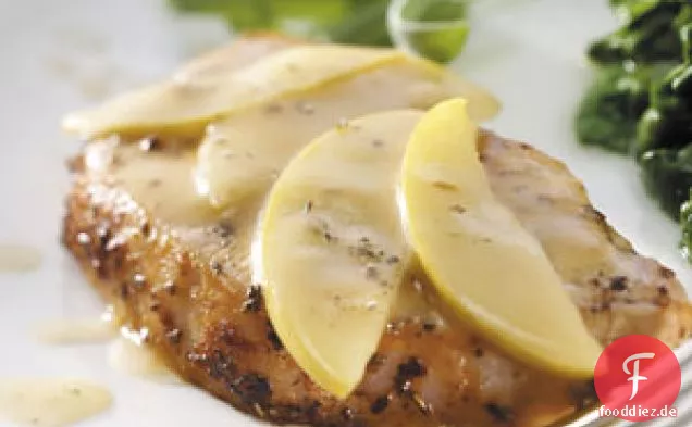 Glasierte Schweinekoteletts und Äpfel