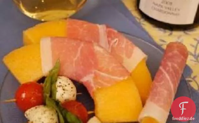 Mit Prosciutto umwickelte Melone und Breadsticks