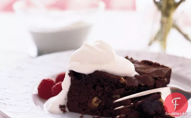 Chocolate Cake with Cashews, Berries and Whipped Cream