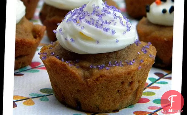 Pumpkin Gingerbread Muffins With Orange Cream Cheese Frosting