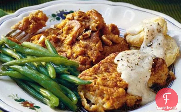 Gebratene Schweinekoteletts mit Sahnesoße