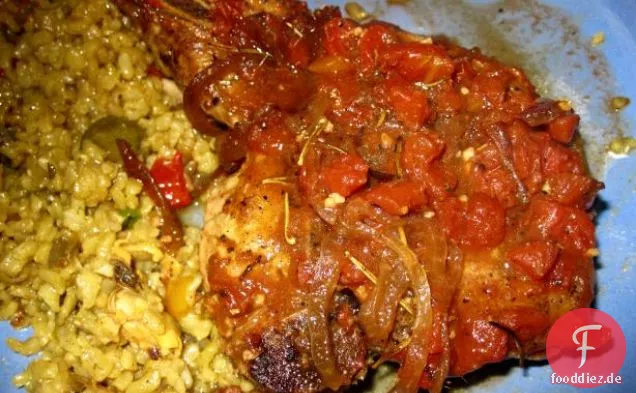 Geschmorte Schweinekoteletts mit Tomaten