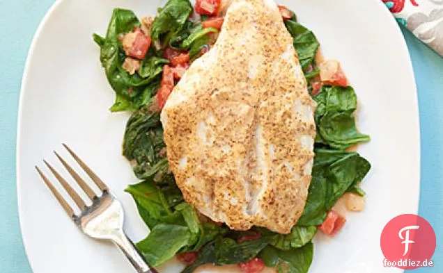 Red Snapper über sautierten Spinat und Tomaten