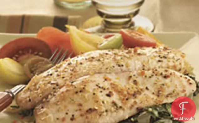 Gebackene Tilapia mit Knoblauch und Kräuteröl