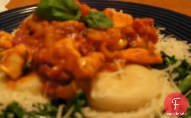 Spicy Chicken Rustica auf Ravioli und Rucola
